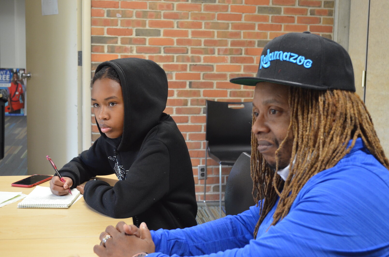 Regina Kibezi and Michael Wilder, coordinator of the city of Kalamazoo’s Group Violence Intervention Program, which aims to stop gun violence. 