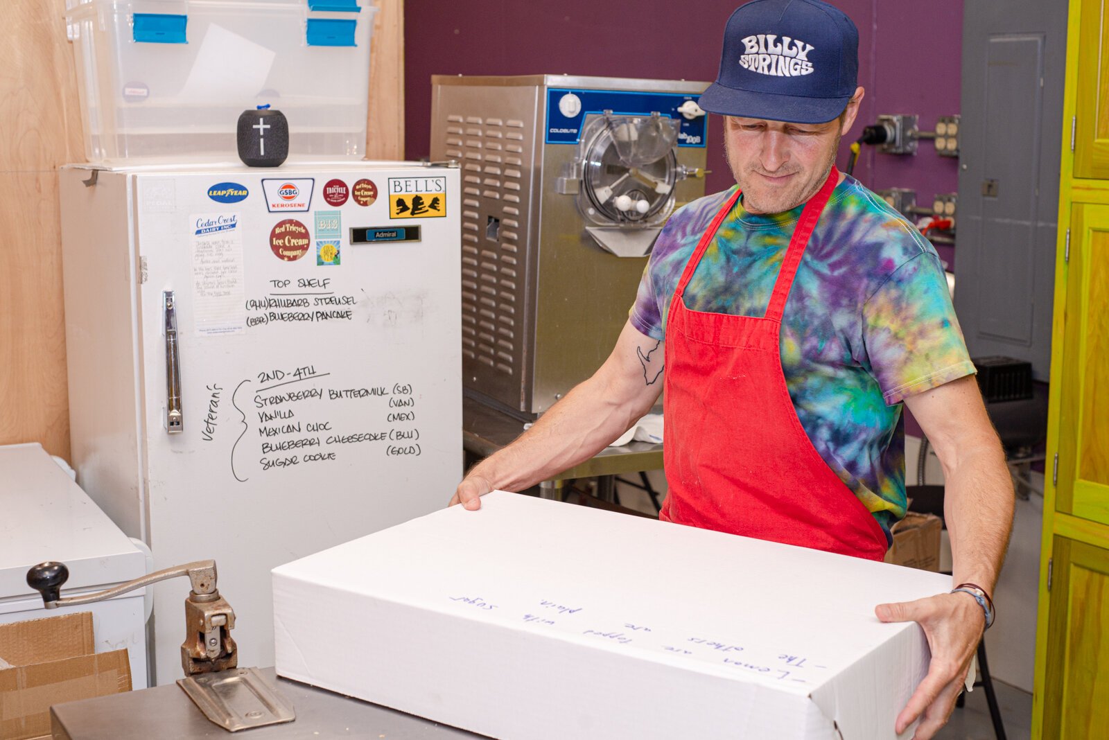 Ken Quayle with a box of Strawberry Buttermilk ice cream sandwiches constructed with Lemon Sugar Cookies made special by Sarkozy’s Bakery.