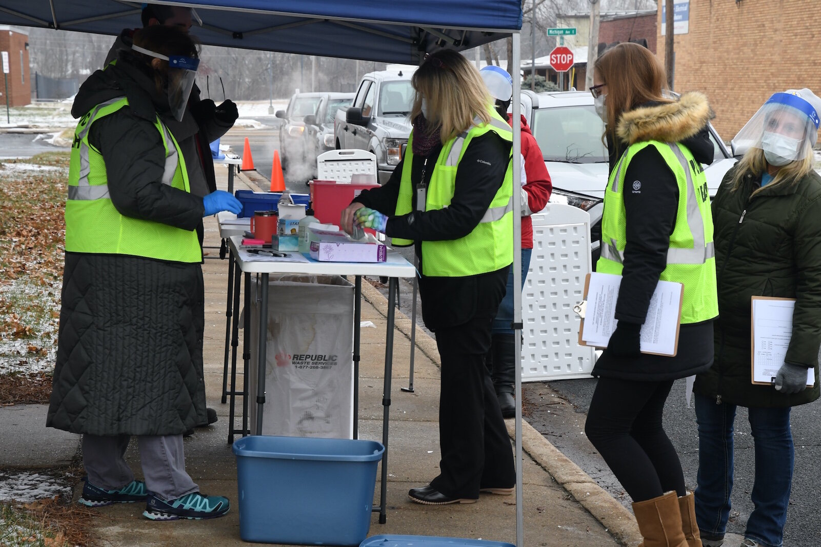 Calhoun County Health Department employees prepare to give a dose of Pfizer/BioNTech COVID-19 vaccine in Battle Creek Friday morning.