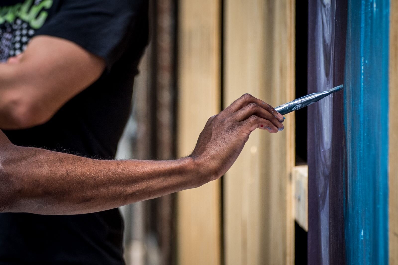 Artists converged on downtown Kalamazoo Saturday and Sunday to turn boarded up storefronts into art spaces.