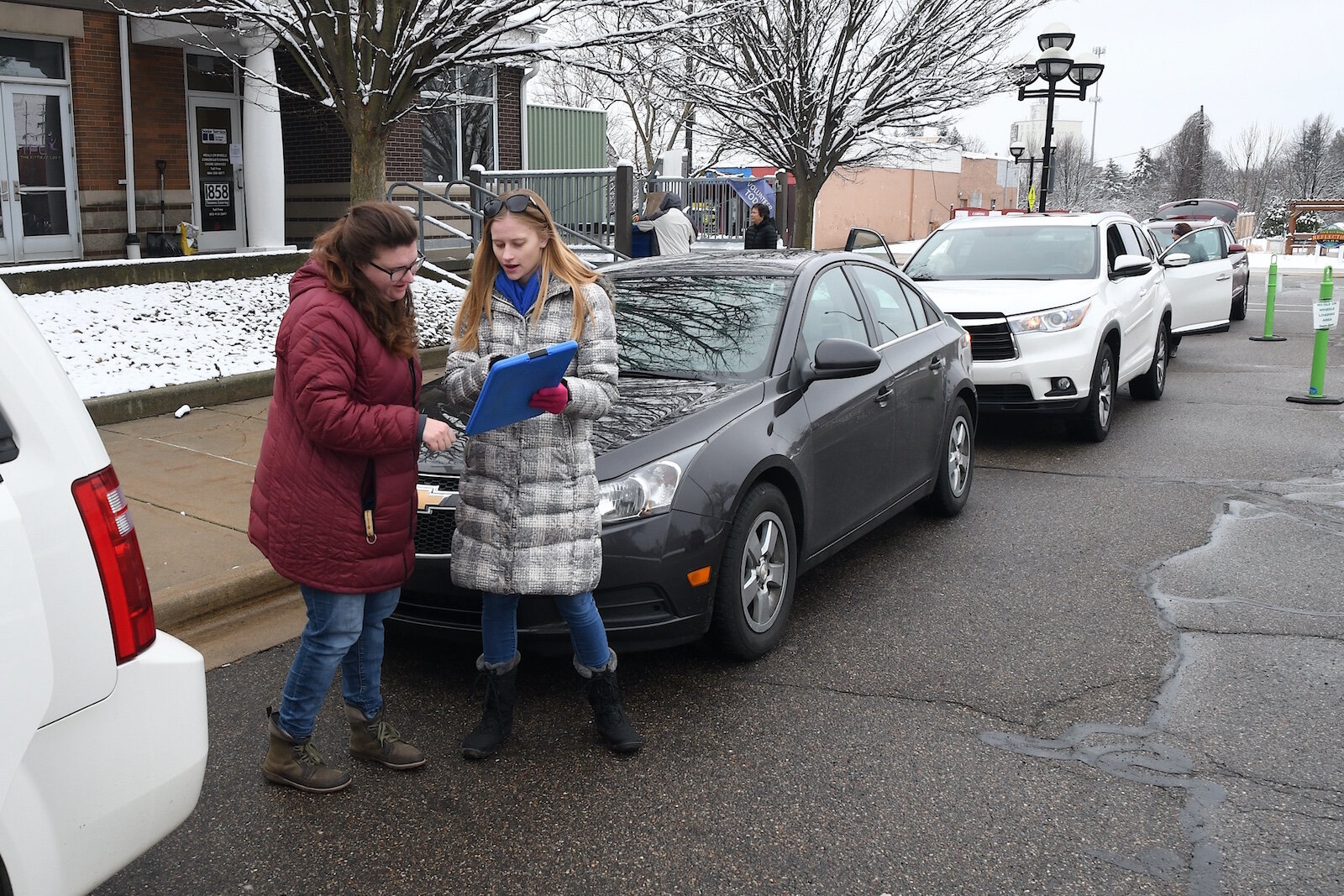 Meals on wheels volunteers get ready to take off from the Kool Center to deliver their meals.