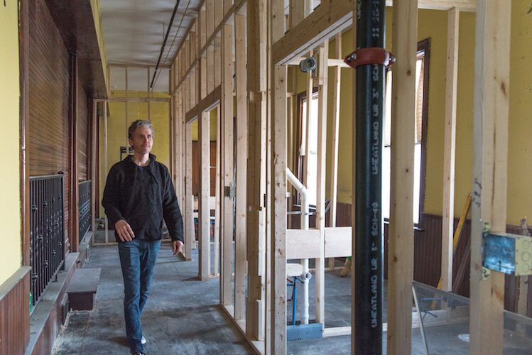 Comedy troupe leader Stephen Dupuie is shown recently inside the church building that is being renovated for use as a theater.