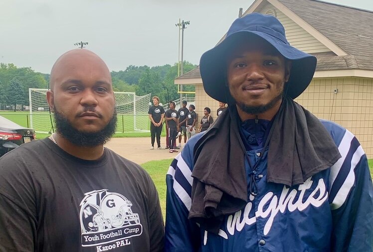 Javon Miles, assistant football coach at Kalamazoo Central High School, left, stands with Damion Coleman-West, assistant football coach at Loy Norrix High School.